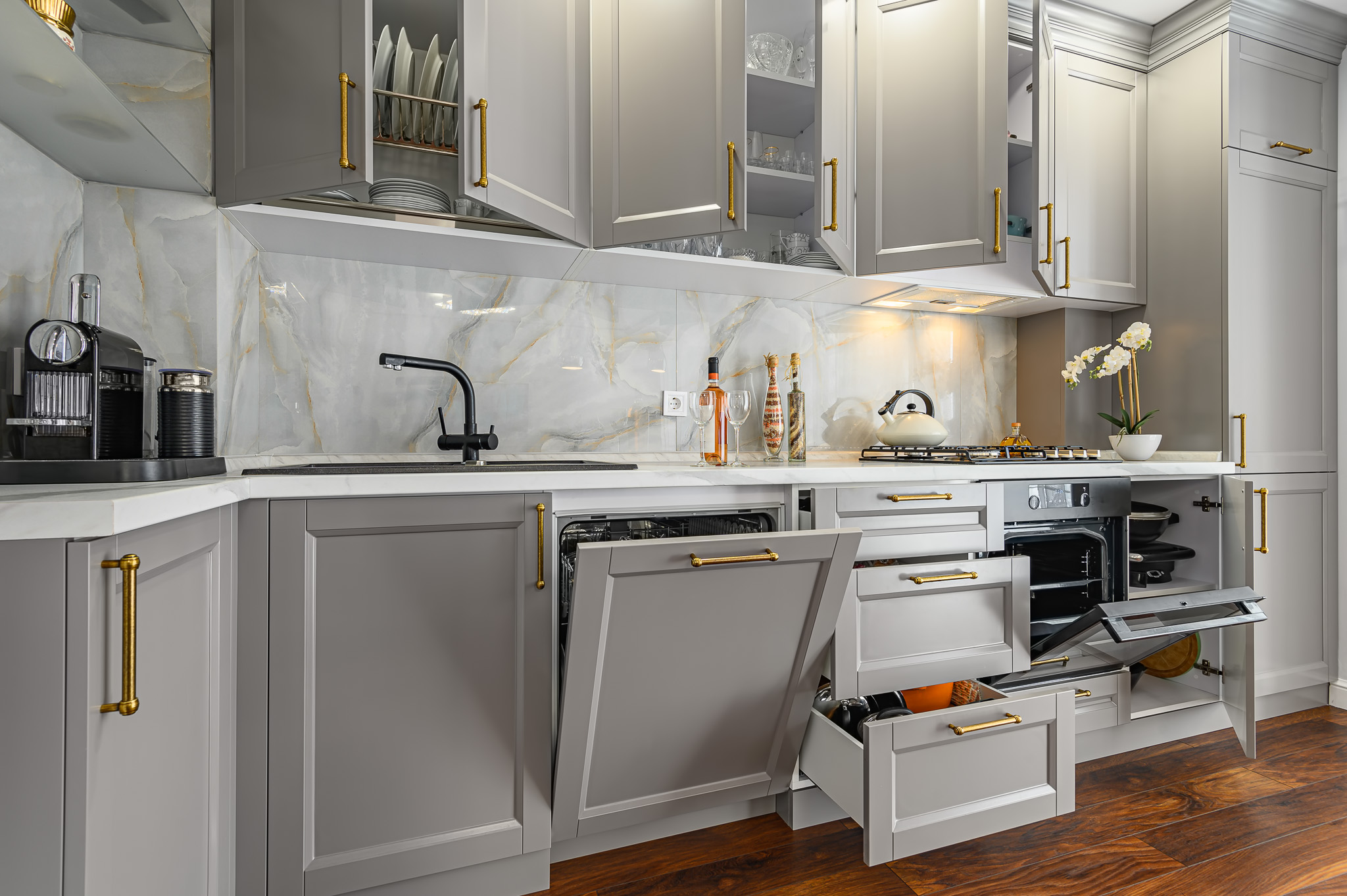 Closeup details of grey and white modern classic kitchen, all doors are open